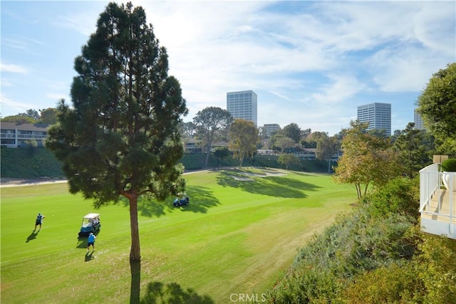 surrounding community with a yard