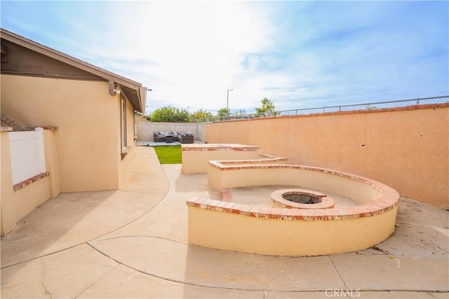 view of patio / terrace with a fire pit