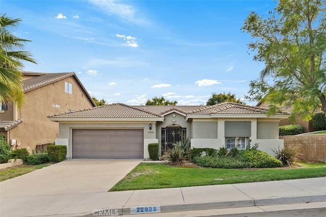 mediterranean / spanish-style home featuring a garage