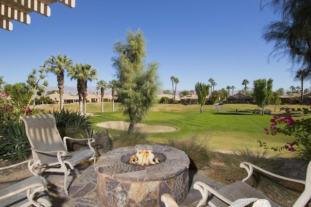 view of yard featuring an outdoor fire pit