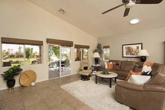 tiled living room featuring high vaulted ceiling and ceiling fan