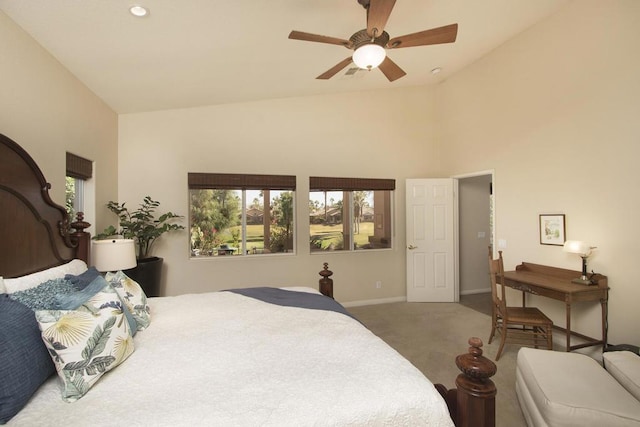 bedroom with ceiling fan, high vaulted ceiling, and carpet floors