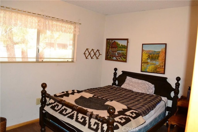 bedroom with hardwood / wood-style floors