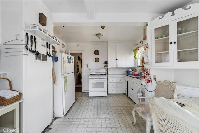 kitchen with white cabinets and white appliances