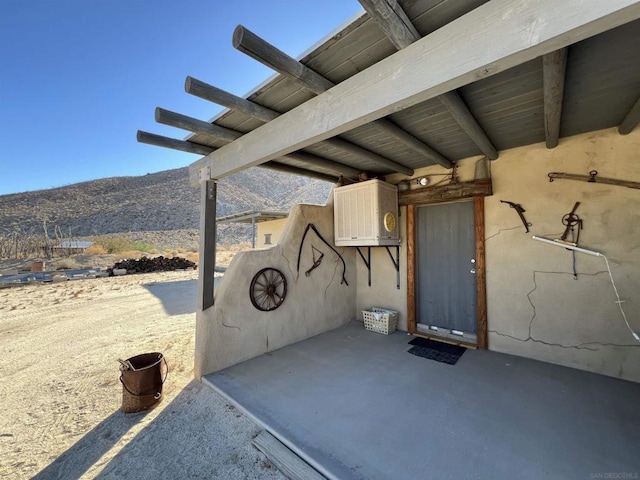 view of patio / terrace with a mountain view