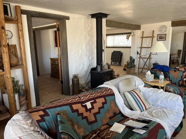 tiled bedroom featuring a wood stove