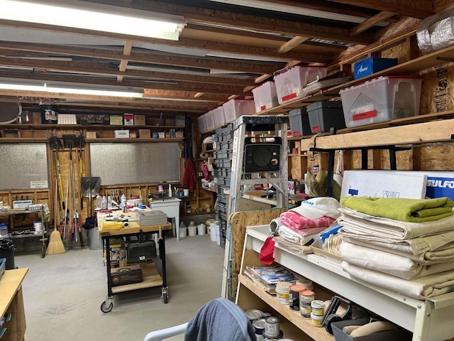 interior space with a workshop area and concrete floors