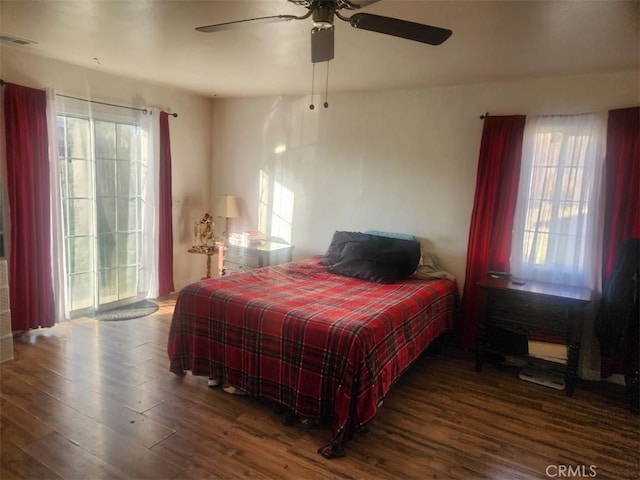 bedroom featuring ceiling fan and dark hardwood / wood-style floors