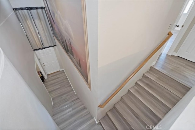 staircase featuring hardwood / wood-style floors