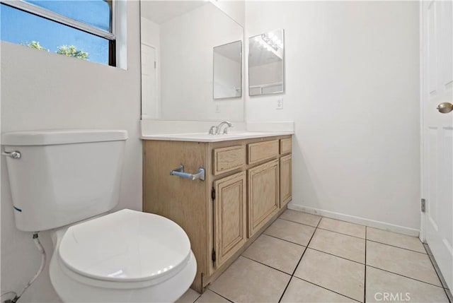 bathroom featuring tile patterned floors, vanity, and toilet