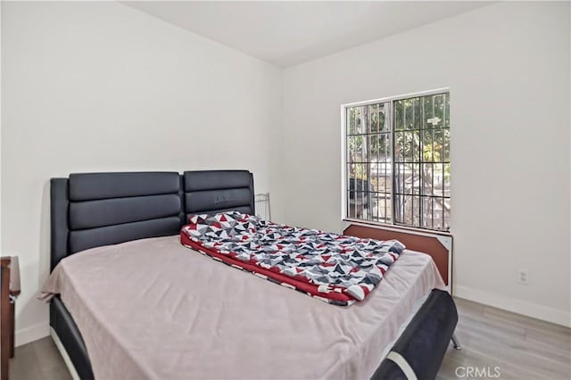 bedroom with light hardwood / wood-style floors