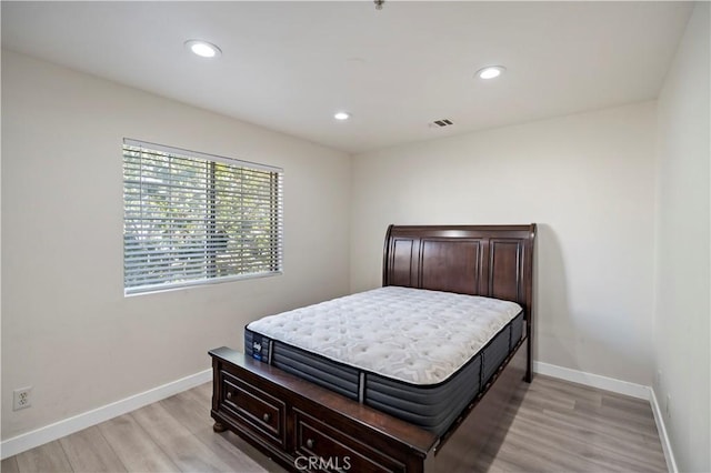 bedroom with light hardwood / wood-style floors