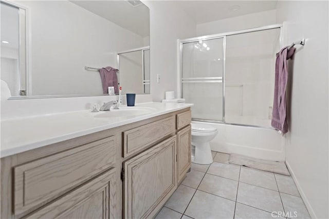 full bathroom featuring tile patterned flooring, vanity, toilet, and shower / bath combination with glass door