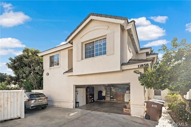 back of house with a garage