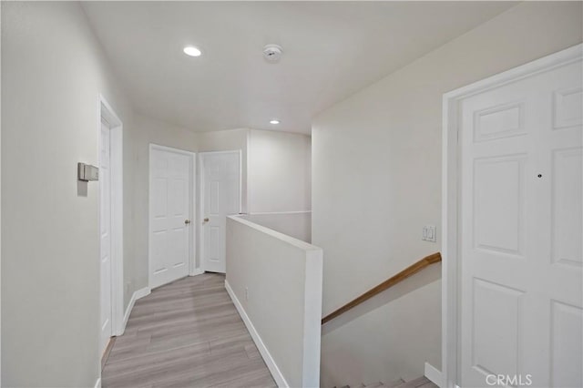 corridor featuring light hardwood / wood-style floors