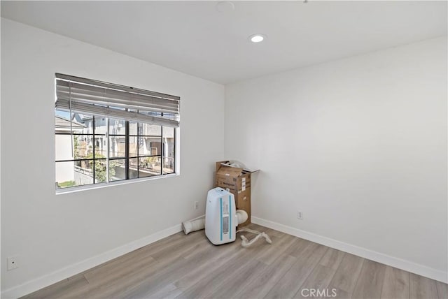 spare room with light hardwood / wood-style flooring