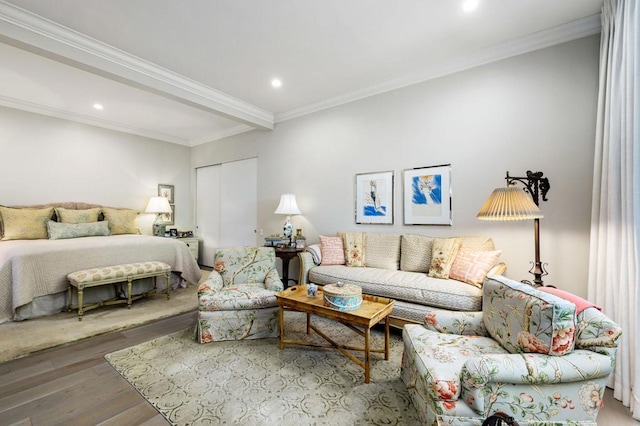 bedroom with beam ceiling, crown molding, and hardwood / wood-style flooring