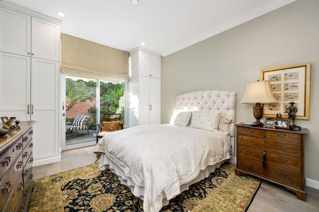 bedroom with access to exterior, light hardwood / wood-style floors, and ornamental molding