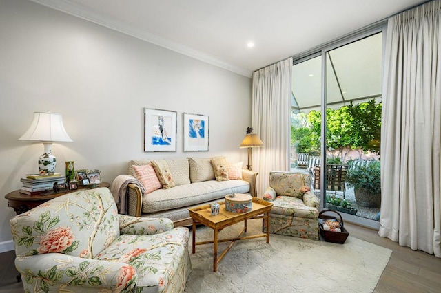 living room featuring hardwood / wood-style floors and ornamental molding