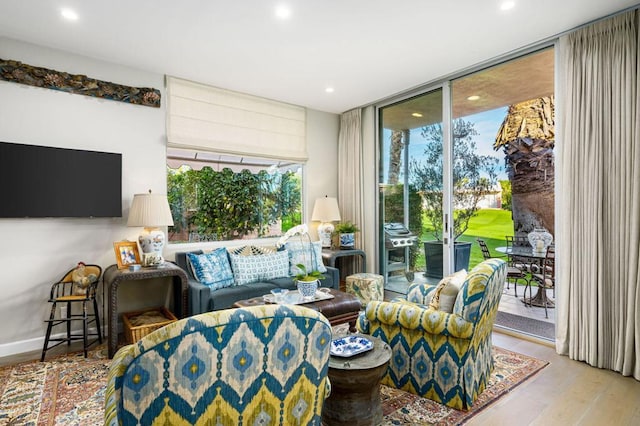 living room featuring hardwood / wood-style floors and expansive windows