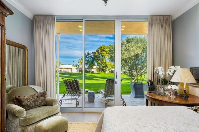 bedroom featuring access to exterior, wood-type flooring, and crown molding