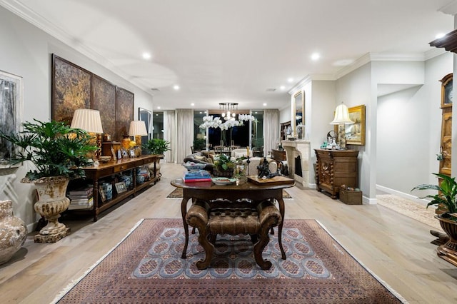 dining room featuring ornamental molding and light wood-type flooring