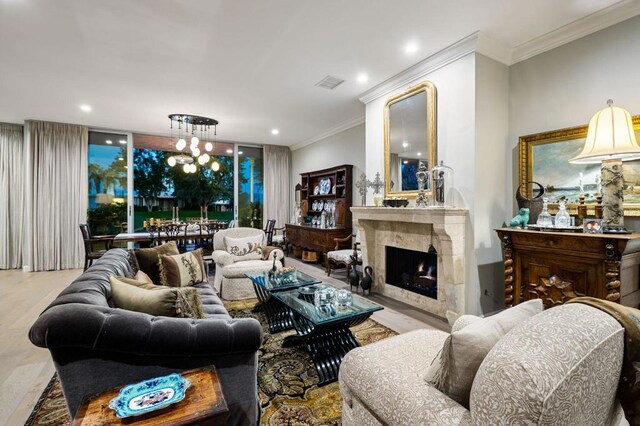 living room featuring a fireplace and crown molding