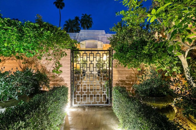 view of gate at twilight