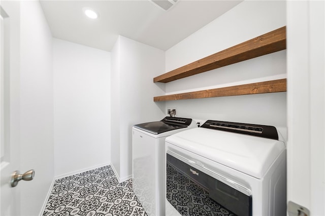 clothes washing area with washer and dryer