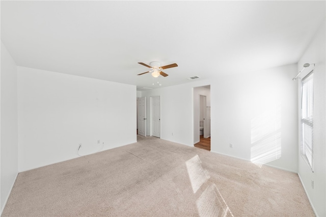 carpeted empty room with ceiling fan