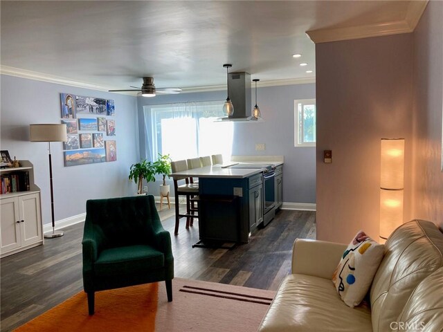 living room featuring dark hardwood / wood-style floors, ceiling fan, and crown molding