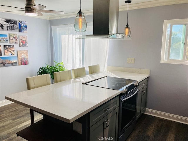 kitchen featuring dark hardwood / wood-style flooring, a breakfast bar, island range hood, black electric range oven, and hanging light fixtures