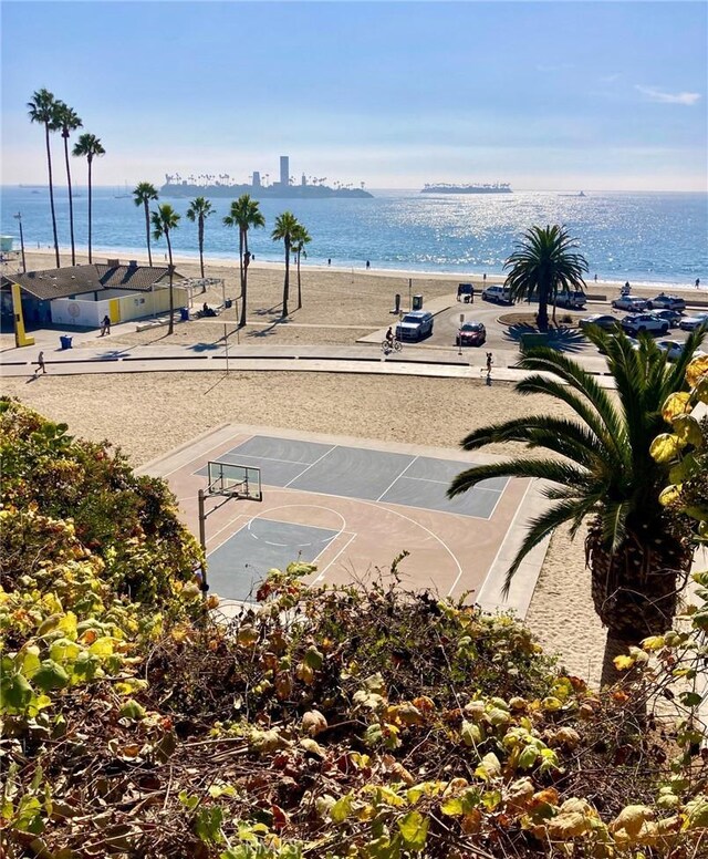 view of sport court featuring a water view