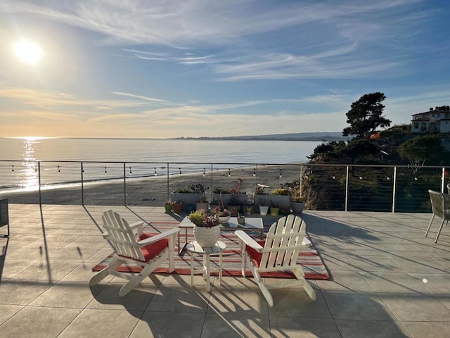 patio terrace at dusk with a water view