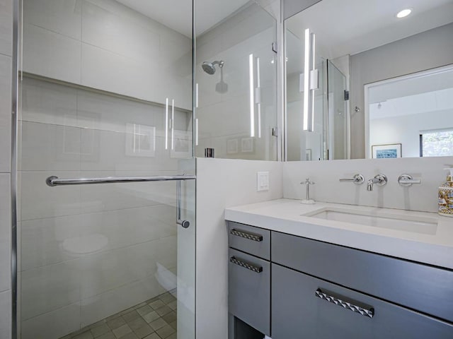 bathroom with vanity and walk in shower