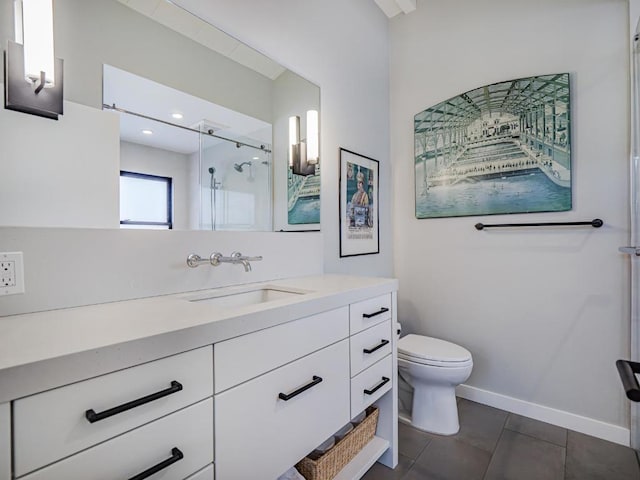 bathroom featuring vanity, tile patterned flooring, toilet, and walk in shower