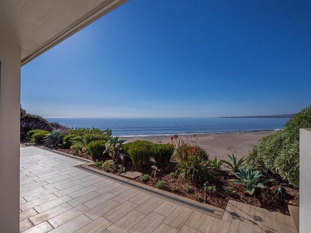 property view of water featuring a beach view