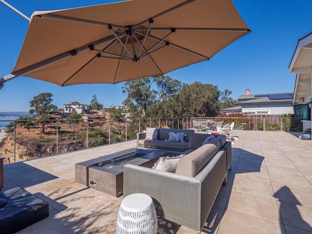 view of patio / terrace featuring an outdoor living space with a fire pit