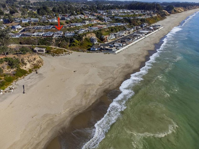 bird's eye view with a view of the beach and a water view