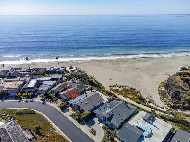 aerial view featuring a water view and a beach view