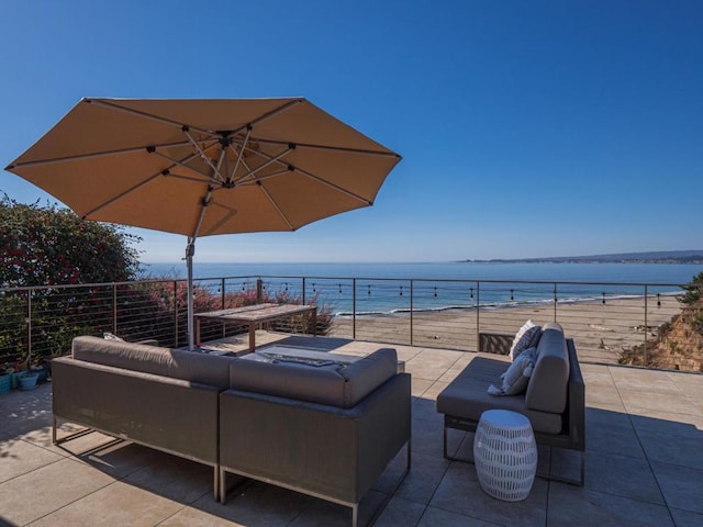 view of patio / terrace with a water view and outdoor lounge area