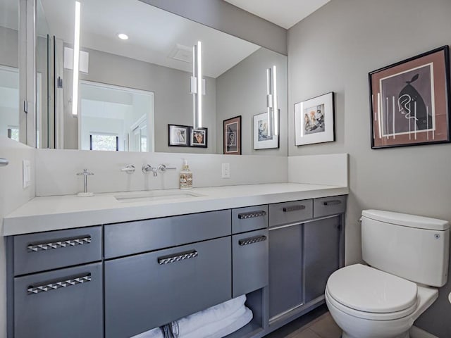 bathroom with vanity and toilet