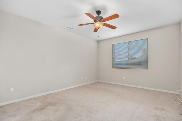 carpeted empty room with ceiling fan