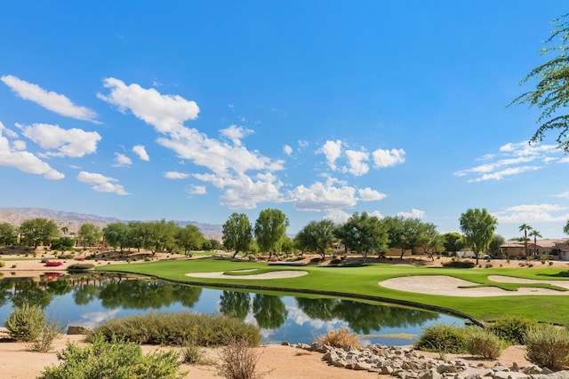 surrounding community featuring a water and mountain view