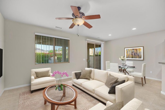 living room featuring ceiling fan and light tile patterned flooring