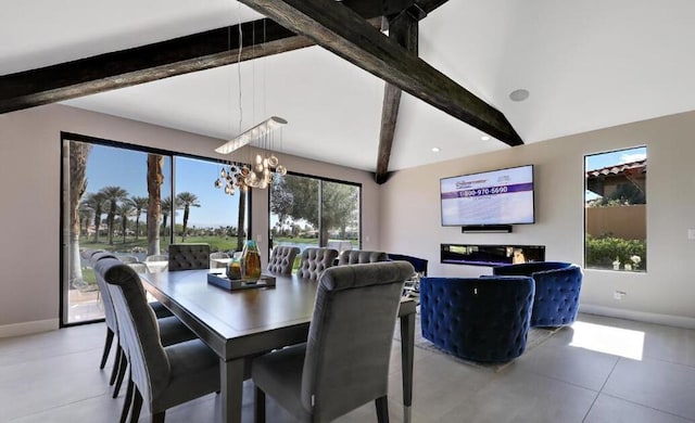 dining room featuring beam ceiling, a healthy amount of sunlight, tile patterned flooring, and an inviting chandelier