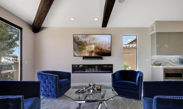 living room with beamed ceiling