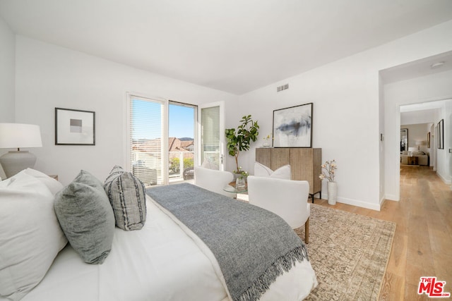 bedroom with light hardwood / wood-style floors