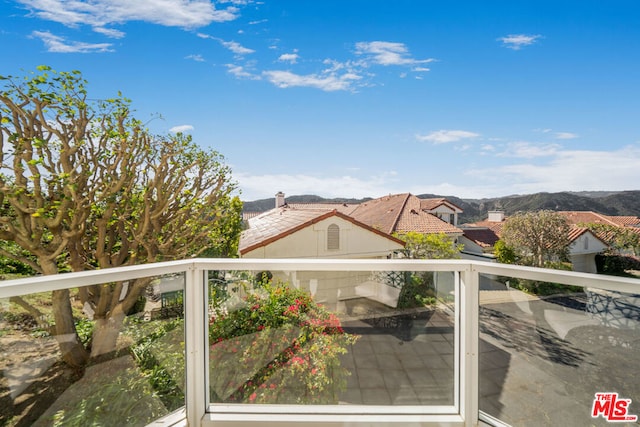 balcony featuring a mountain view