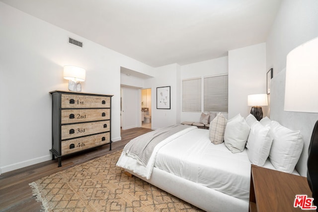 bedroom featuring dark wood-type flooring